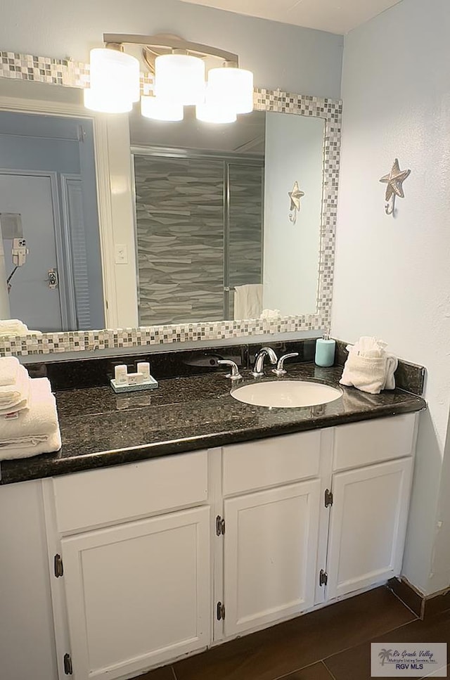 200 Padre Blvd Unit A314 1314, South Padre Island, TX 78597 - bathroom with vanity, backsplash, and a shower