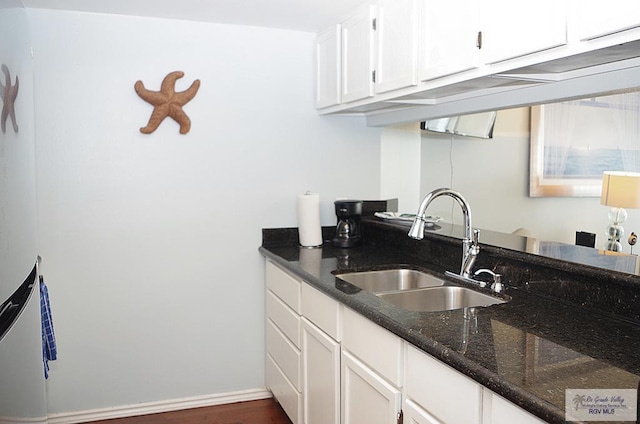 200 Padre Blvd Unit A314 1314, South Padre Island, TX 78597 - kitchen with white cabinets, dark stone counters, and dark wood-style floors