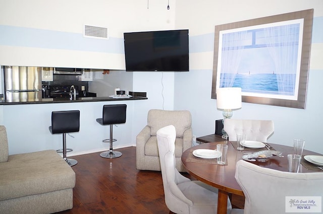 living room with dark hardwood / wood-style floors and sink