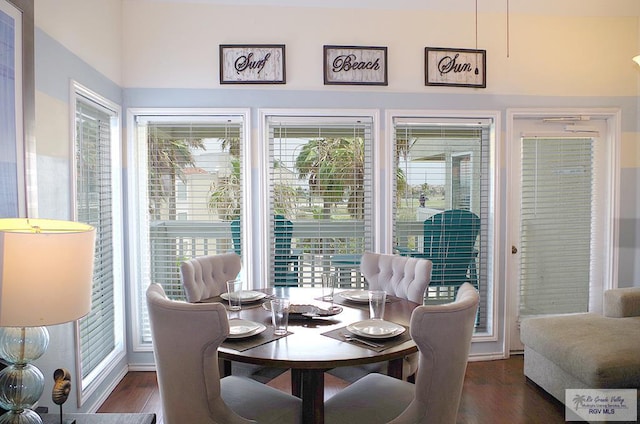 dining space with dark wood-type flooring