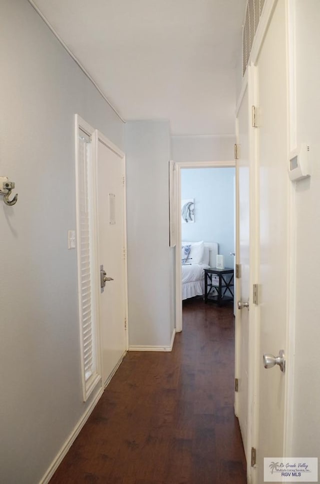 corridor featuring dark wood-type flooring