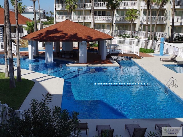 view of swimming pool featuring a gazebo and a patio