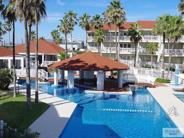 view of swimming pool featuring a gazebo and a patio area