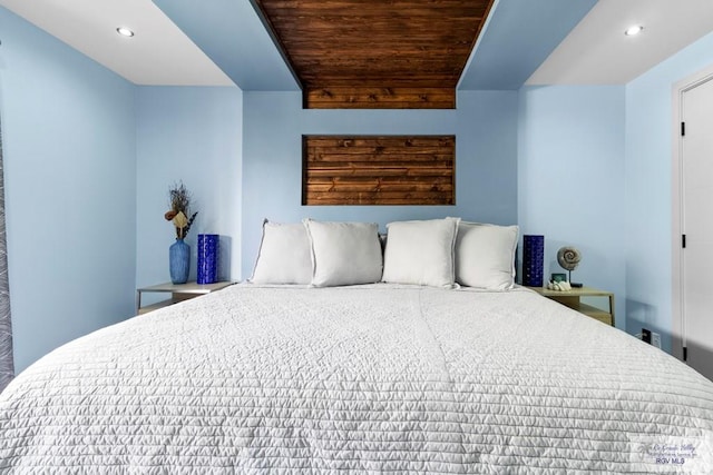 bedroom with recessed lighting and wood ceiling