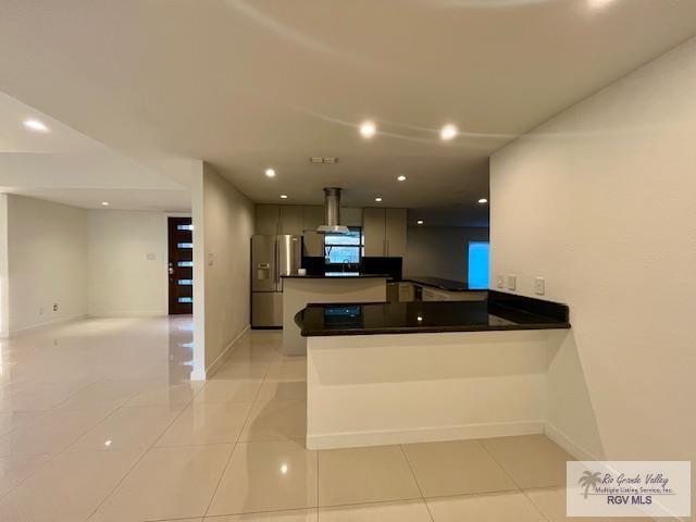 kitchen with stainless steel refrigerator with ice dispenser, island exhaust hood, kitchen peninsula, and light tile patterned flooring