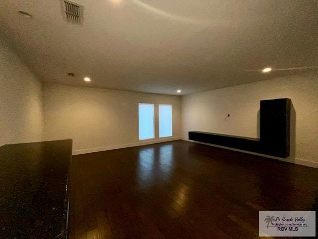 spare room with hardwood / wood-style floors