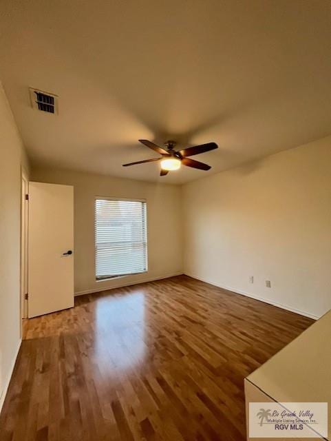 unfurnished room featuring ceiling fan and hardwood / wood-style floors