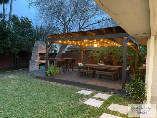 view of yard featuring a fireplace and a deck