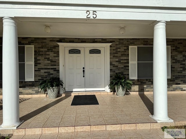 entrance to property with covered porch