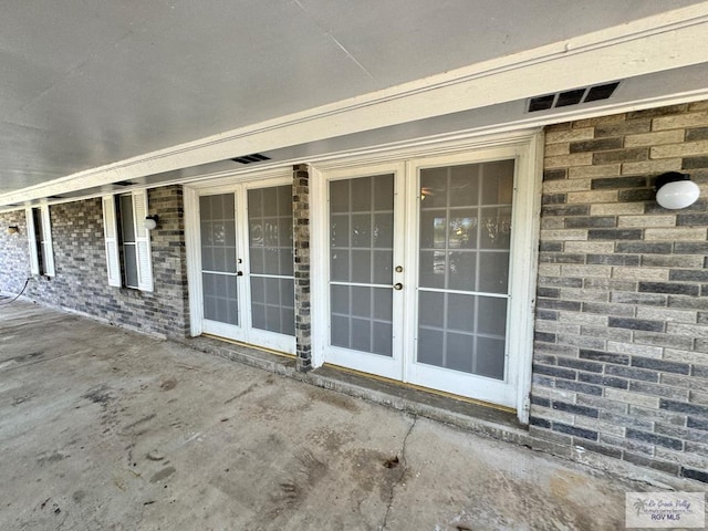 doorway to property with french doors