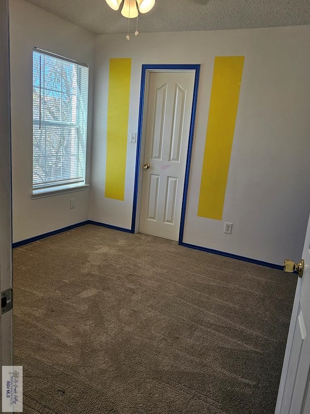 1149 Champlain Dr, Brownsville, TX 78526 - empty room featuring carpet, a textured ceiling, and ceiling fan
