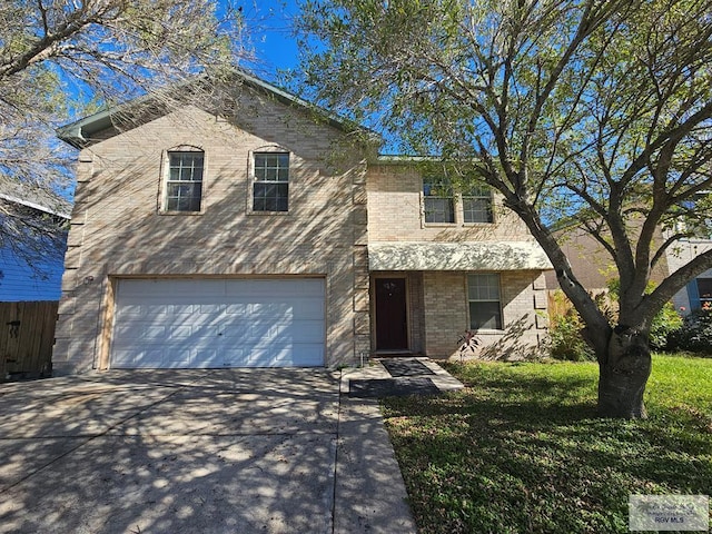 view of front of property with a front yard and a garage