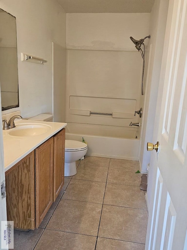 1149 Champlain Dr, Brownsville, TX 78526 - full bathroom with tile patterned flooring, vanity, bathtub / shower combination, and toilet
