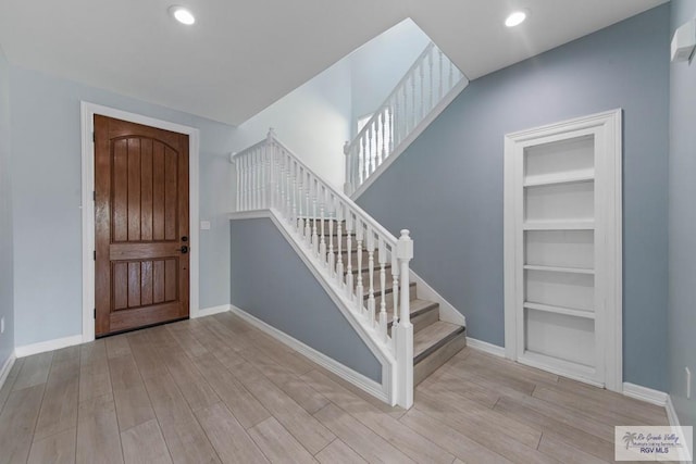 1013 Tarpon Ave, Port Isabel, TX 78578 - foyer entrance with wood finished floors, stairway, baseboards, and recessed lighting