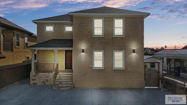 1013 Tarpon Ave, Port Isabel, TX 78578 - view of front facade with a shingled roof and a gate