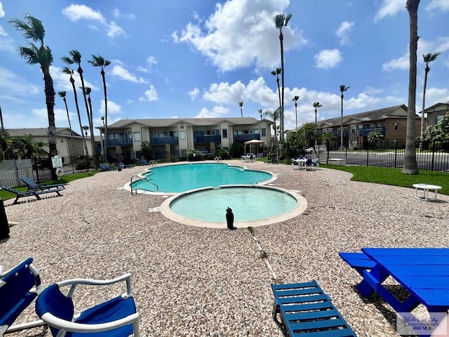 77 Santa Isabel Blvd Unit K 6, Laguna Vista, TX 78578 - community pool featuring a residential view and a patio area