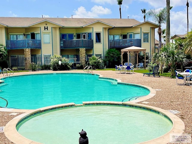 77 Santa Isabel Blvd Unit K 6, Laguna Vista, TX 78578 - view of pool with a gazebo and a pool with connected hot tub