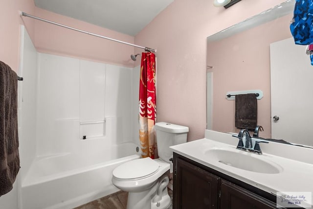 full bathroom featuring vanity, shower / tub combo, and toilet