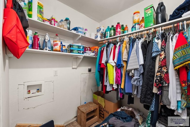 laundry area with washer hookup and hookup for an electric dryer