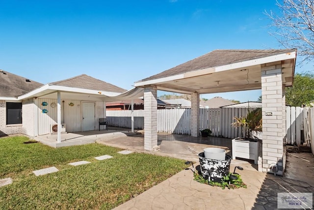 view of yard with a patio area and an outdoor structure