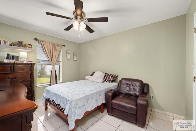 tiled bedroom featuring ceiling fan