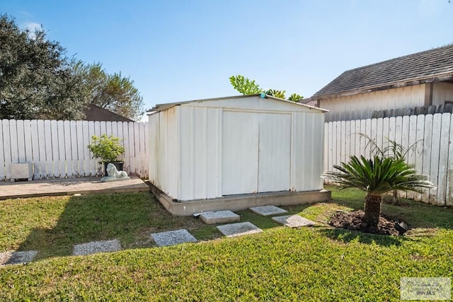 view of outbuilding with a yard