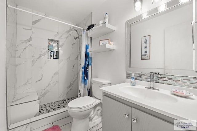 bathroom featuring tasteful backsplash, tile patterned flooring, vanity, walk in shower, and toilet