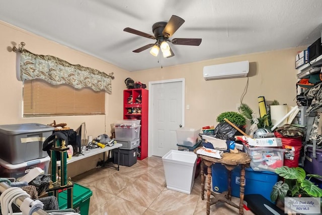 misc room featuring light tile patterned floors, a wall unit AC, and ceiling fan