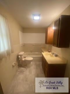 bathroom with a bathtub and vanity