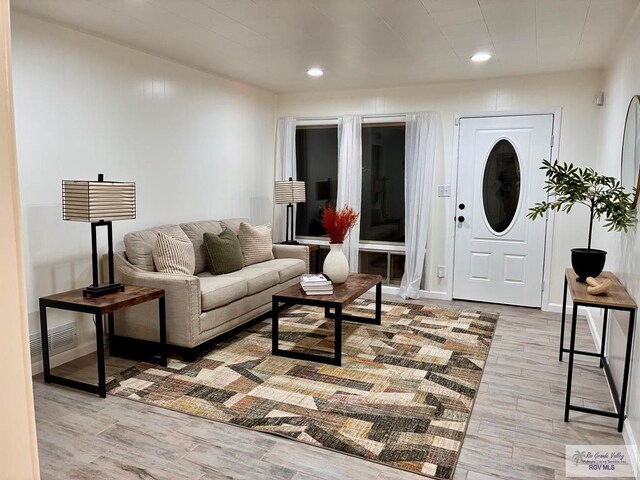 1909 E Madison Ave, Harlingen, TX 78550 - living room with wood finished floors, recessed lighting, and baseboards