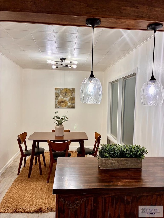 1909 E Madison Ave, Harlingen, TX 78550 - dining area with light wood-style flooring and baseboards