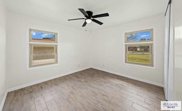 1909 E Madison Ave, Harlingen, TX 78550 - unfurnished room featuring wood finished floors, baseboards, and ceiling fan