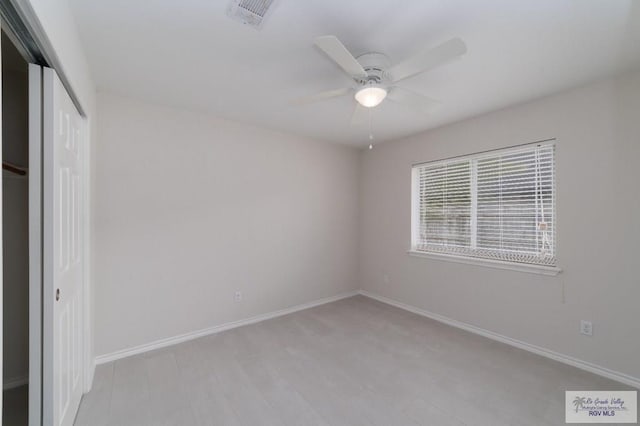 unfurnished bedroom with a closet and ceiling fan