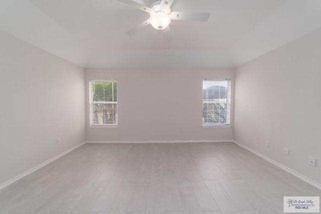 unfurnished room featuring ceiling fan and a healthy amount of sunlight