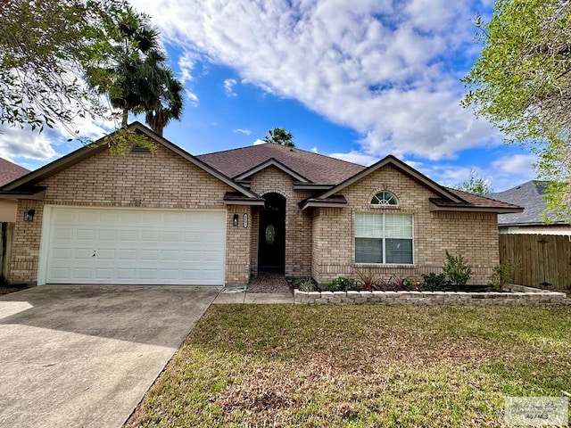 ranch-style home with a garage and a front yard