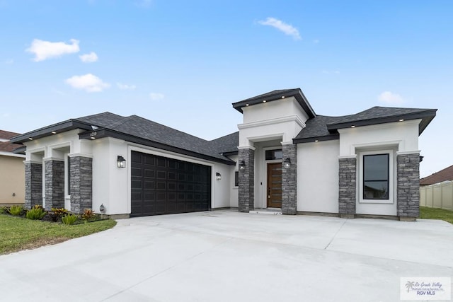 prairie-style house featuring a garage