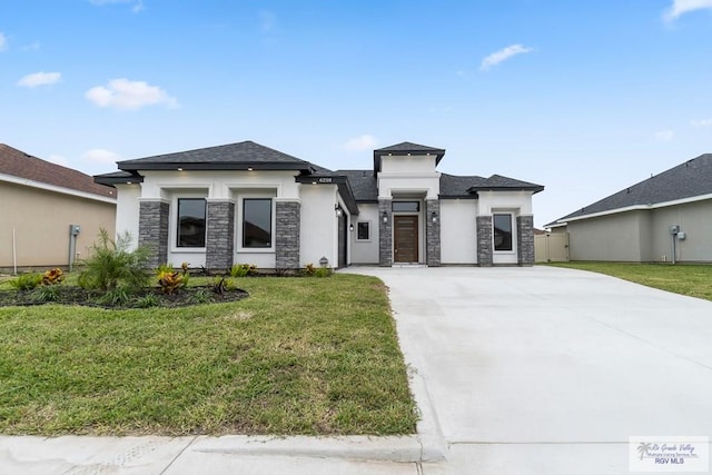 prairie-style home featuring a front lawn