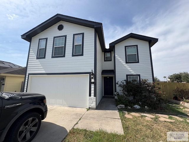 front of property with a garage