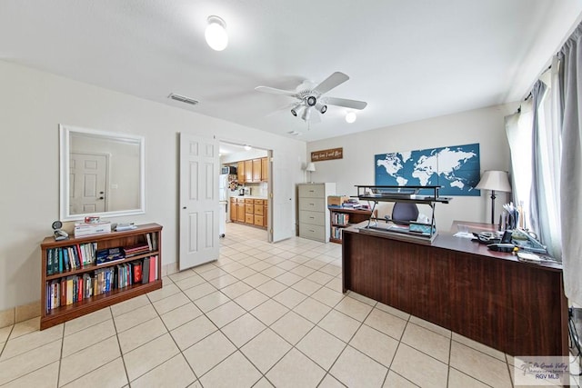 office with ceiling fan and light tile patterned floors