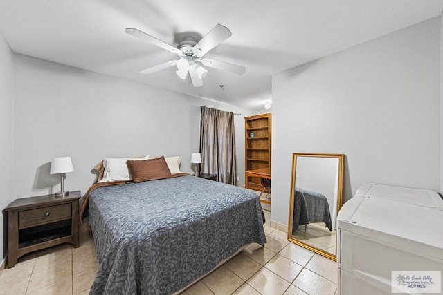 tiled bedroom with ceiling fan