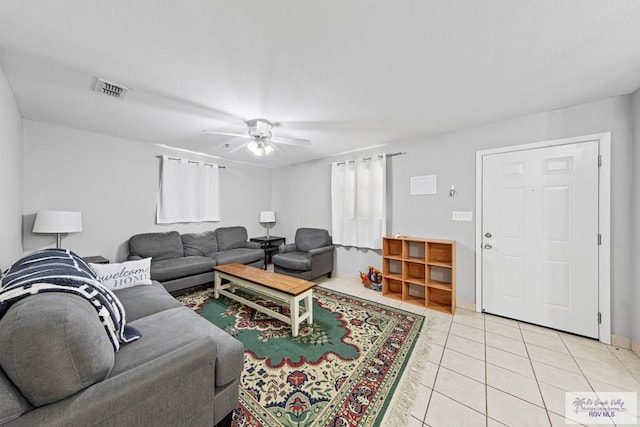 tiled living room featuring ceiling fan