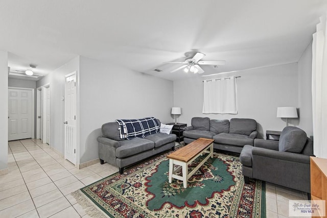 tiled living room featuring ceiling fan