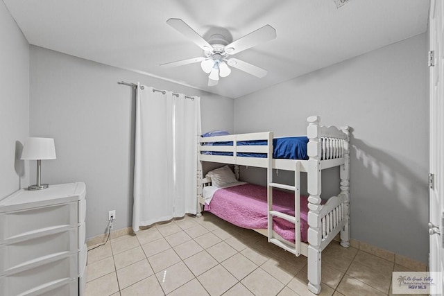 bedroom with ceiling fan and light tile patterned floors