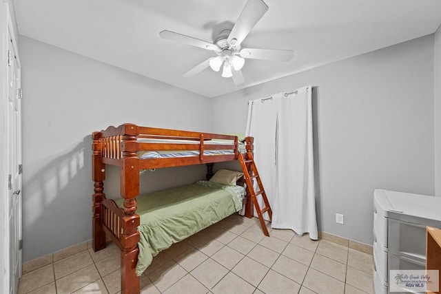 tiled bedroom with ceiling fan