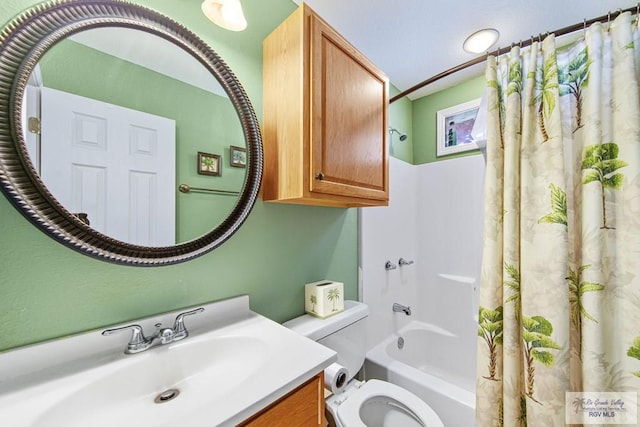 full bathroom with vanity, shower / bath combo, and toilet