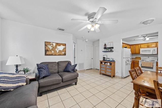 living room featuring ceiling fan and light tile patterned flooring