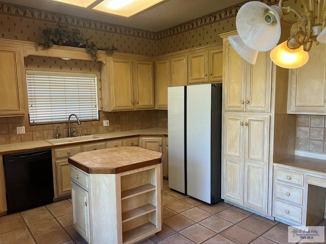 kitchen with a sink, tile counters, dishwasher, freestanding refrigerator, and open shelves