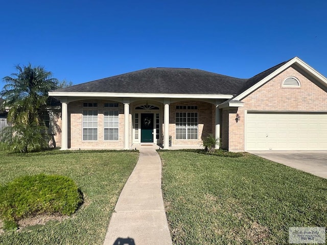 ranch-style house with brick siding, a garage, driveway, and a front yard