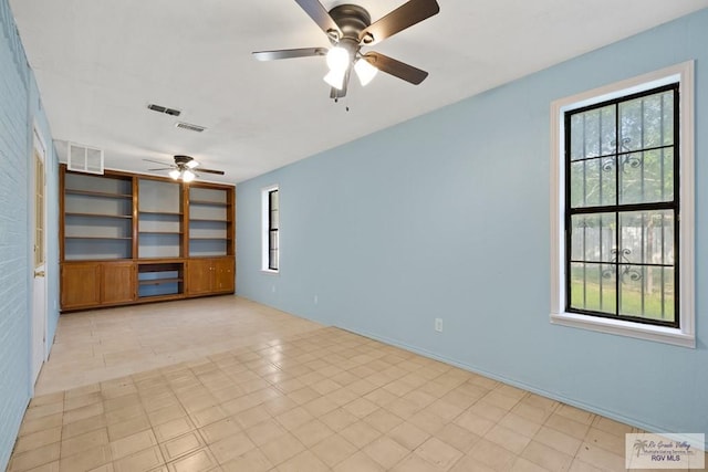 3401 Del Mar Dr, Mission, TX 78574 - spare room with ceiling fan, visible vents, and built in shelves