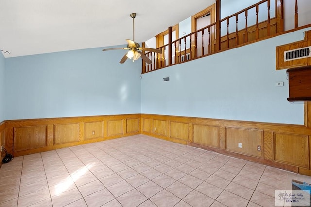 3401 Del Mar Dr, Mission, TX 78574 - spare room featuring a ceiling fan, wainscoting, visible vents, and light tile patterned floors